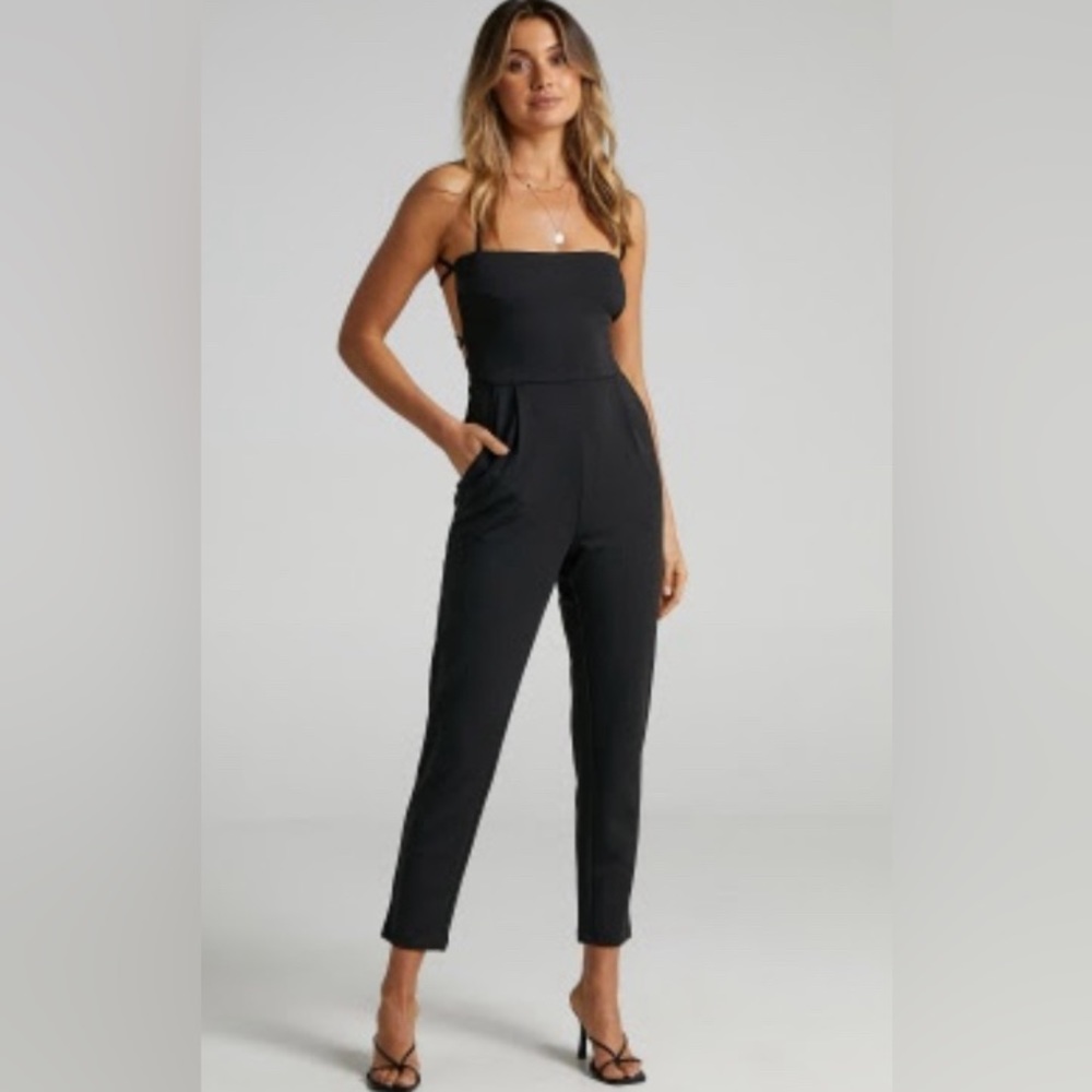 NWT - BRINKLEY STRAPPY OPEN BACK JUMPSUIT IN BLACK - SHOW PO